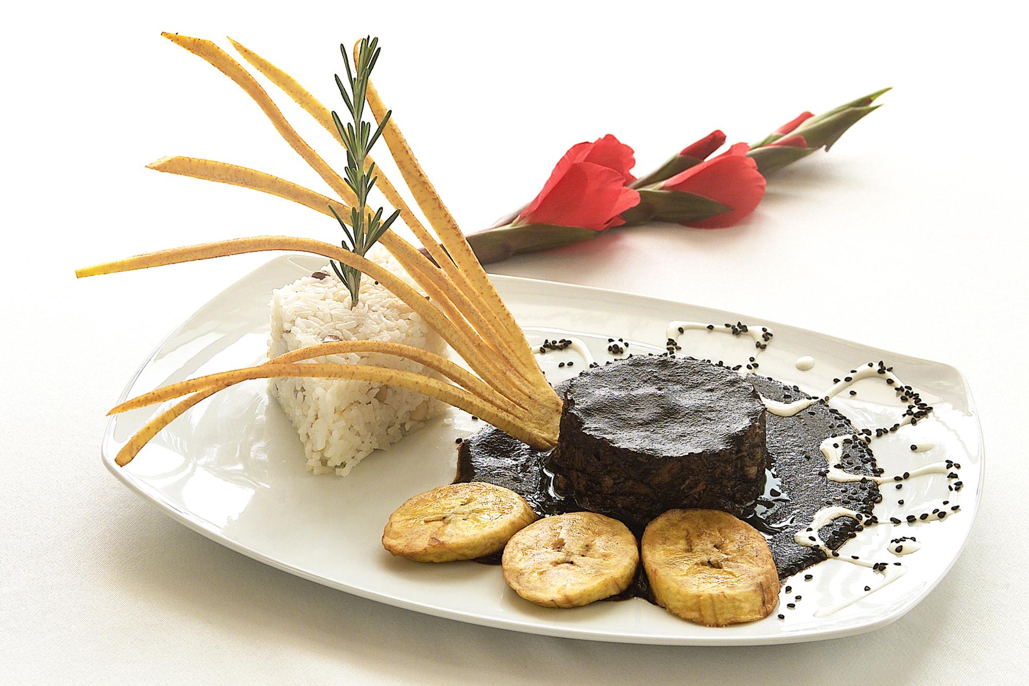 Close-up of plated modern tasting dish on a slate